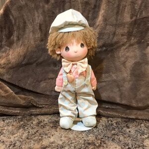 Precious moments cloth doll with stand.